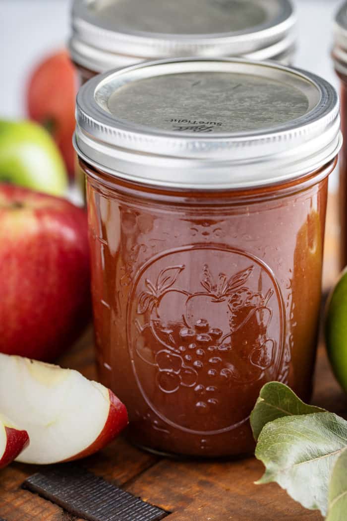 Close up of a jar of canned apple butter.