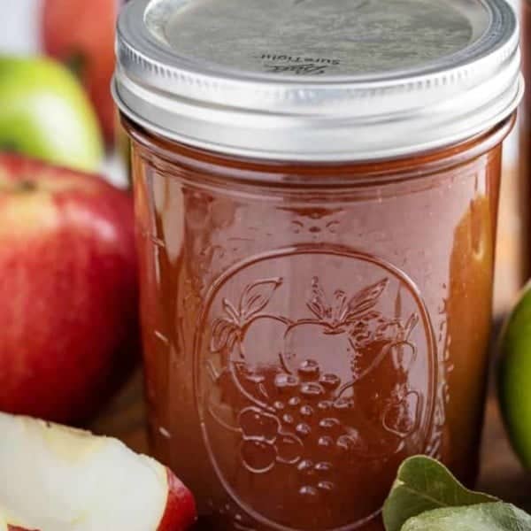 Close up of a jar of canned apple butter.