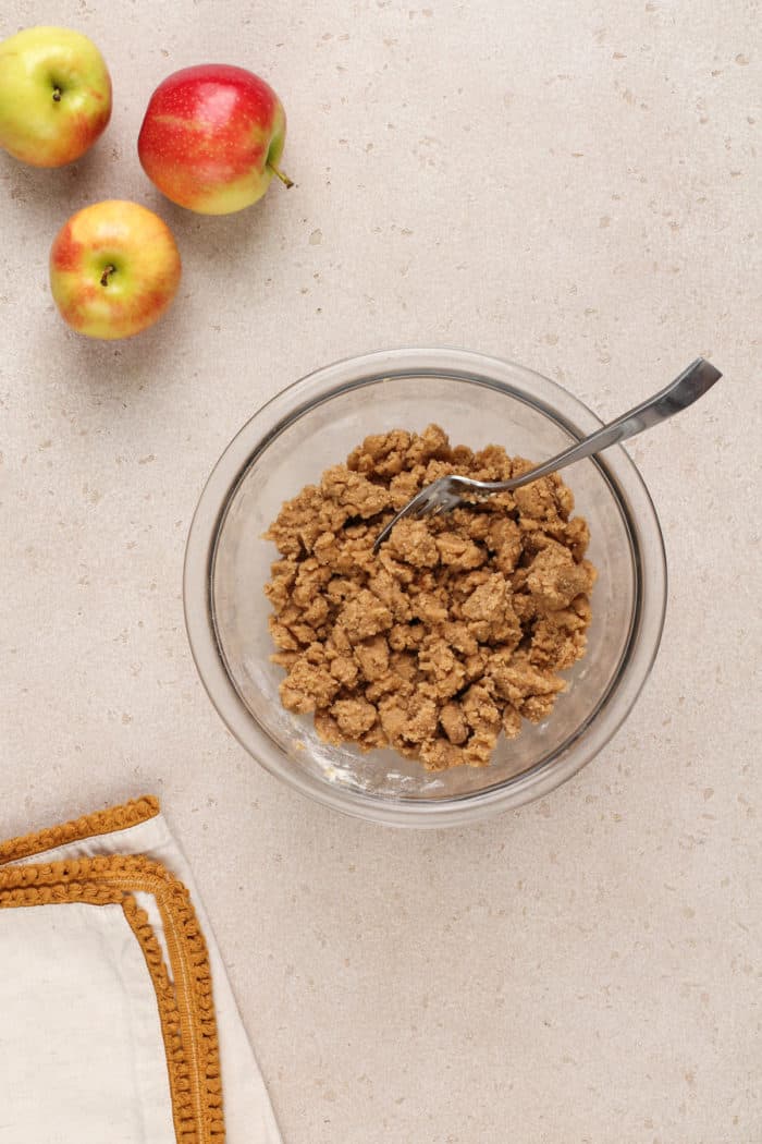 Streusel topping for easy apple coffee cake in a glass mixing bowl.