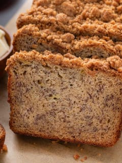 Slices of streusel-topped brown butter banana bread.