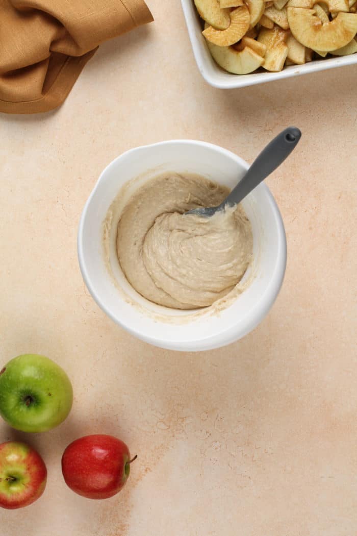 Topping for apple cobbler in a white mixing bowl.