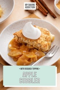 White bowl with a helping of apple cobbler topped with a dollop of whipped cream. Text overlay includes recipe name.