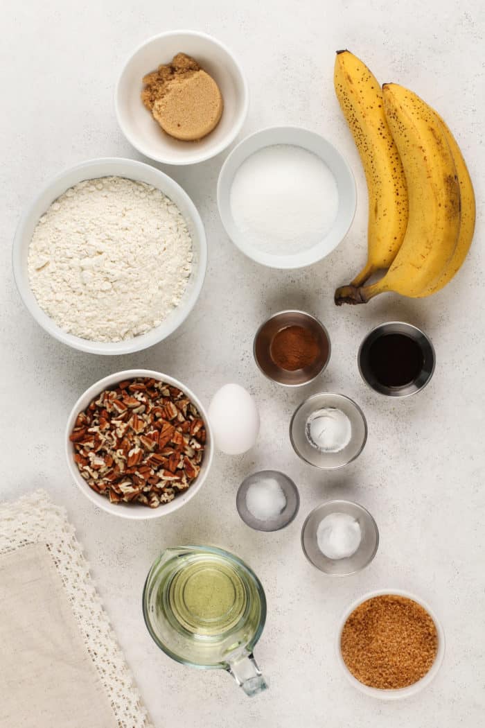 Banana nut muffin ingredients arranged on a countertop.