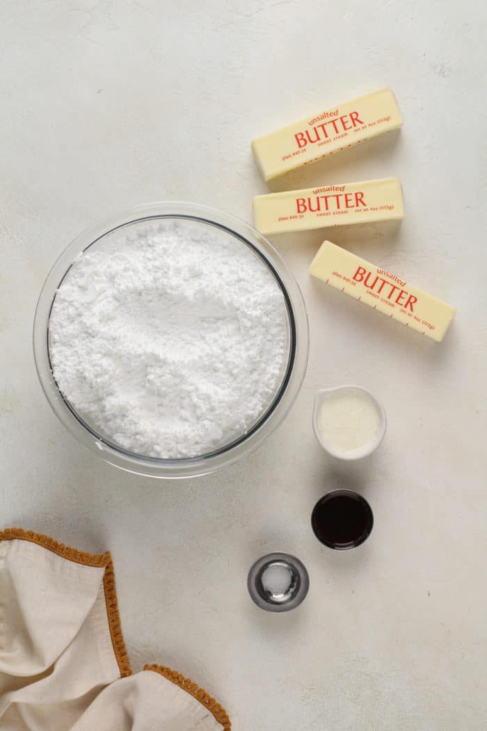 Ingredients for brown butter frosting arranged on a countertop.