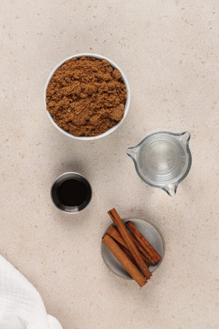 Ingredients for brown sugar syrup on a beige countertop.