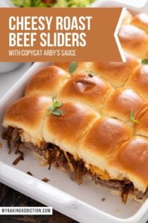 Baked cheesy roast beef sliders in a white pan. Text overlay includes recipe name.