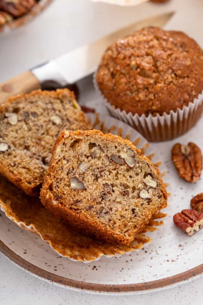 Banana nut muffin cut in half to show the inner texture.