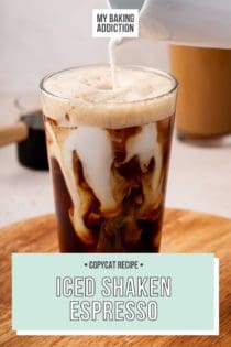 Milk being poured into a glass of iced shaken espresso. Text overlay includes recipe name.