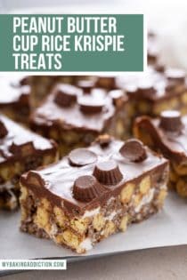 Close up of a peanut butter cup rice krispie treat surrounded by other sliced krispie treats. Text overlay includes recipe name.