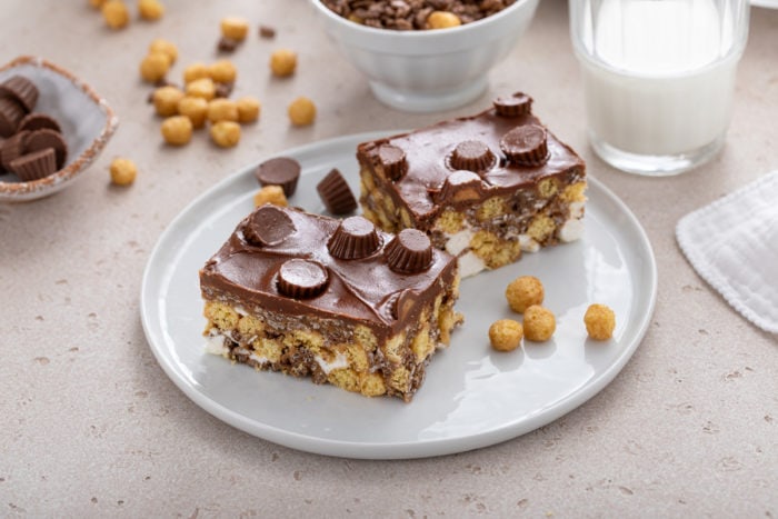 Two plated peanut butter cup rice krispie treats.