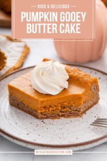 Bite cut from the corner of a plated slice of pumpkin gooey butter cake. Text overlay includes recipe name.