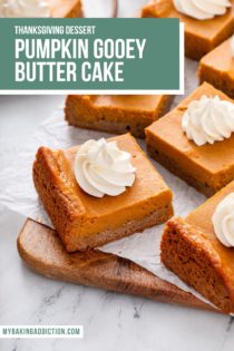 Several slices of pumpkin gooey butter cake arranged on a parchment-lined cutting board. Text overlay includes recipe name.