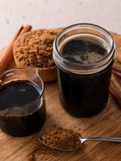 Two jars filled with brown sugar syrup.