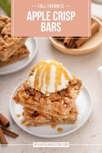 Stack of apple crisp bars topped with ice cream and caramel sauce on a white plate. Text overlay includes recipe name.