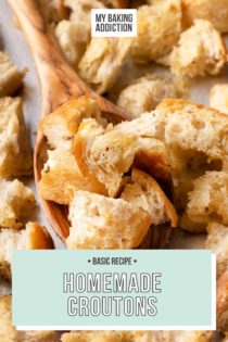 Wooden spoon holding a spoonful of homemade croutons on a baking sheet. Text overlay includes recipe name.