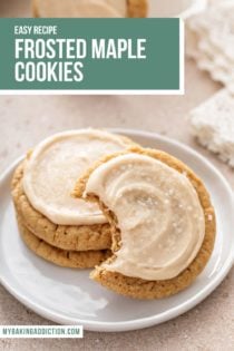 Two stacked maple cookies on a white plate with a third cookie leaning against the stack. A bite has been taken from the third cookie. Text overlay includes recipe name.