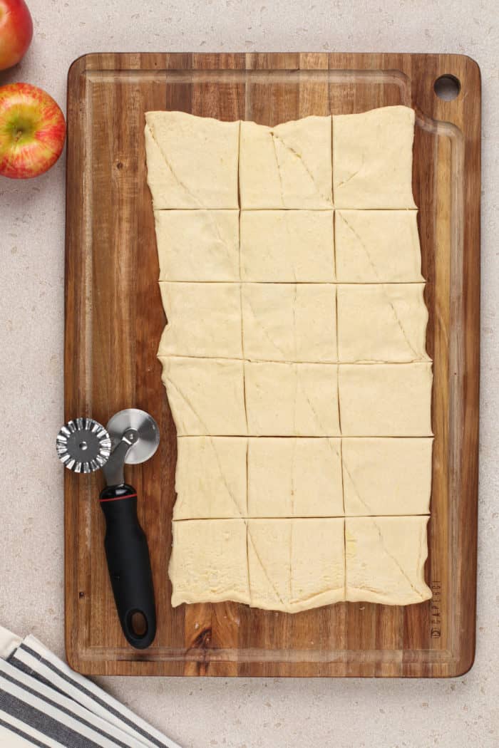 Crescent roll dough rolled out and cut into 18 rectangles.