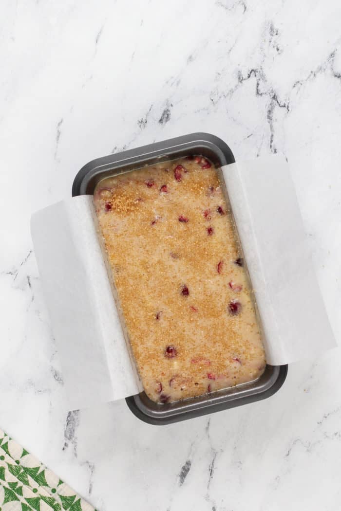 Unbaked cranberry banana bread in a loaf pan, ready to go in the oven.