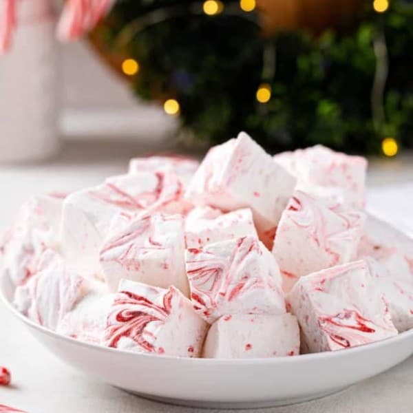 Homemade peppermint marshmallows piled into a white bowl.