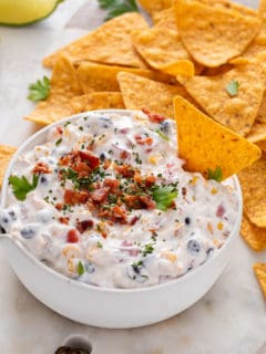 Fiesta ranch dip surrounded by tortilla chips.