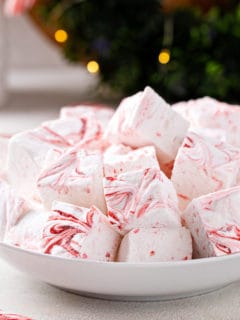 White bowl filled with homemade peppermint marshmallows.
