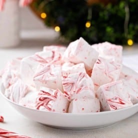 White bowl filled with homemade peppermint marshmallows.