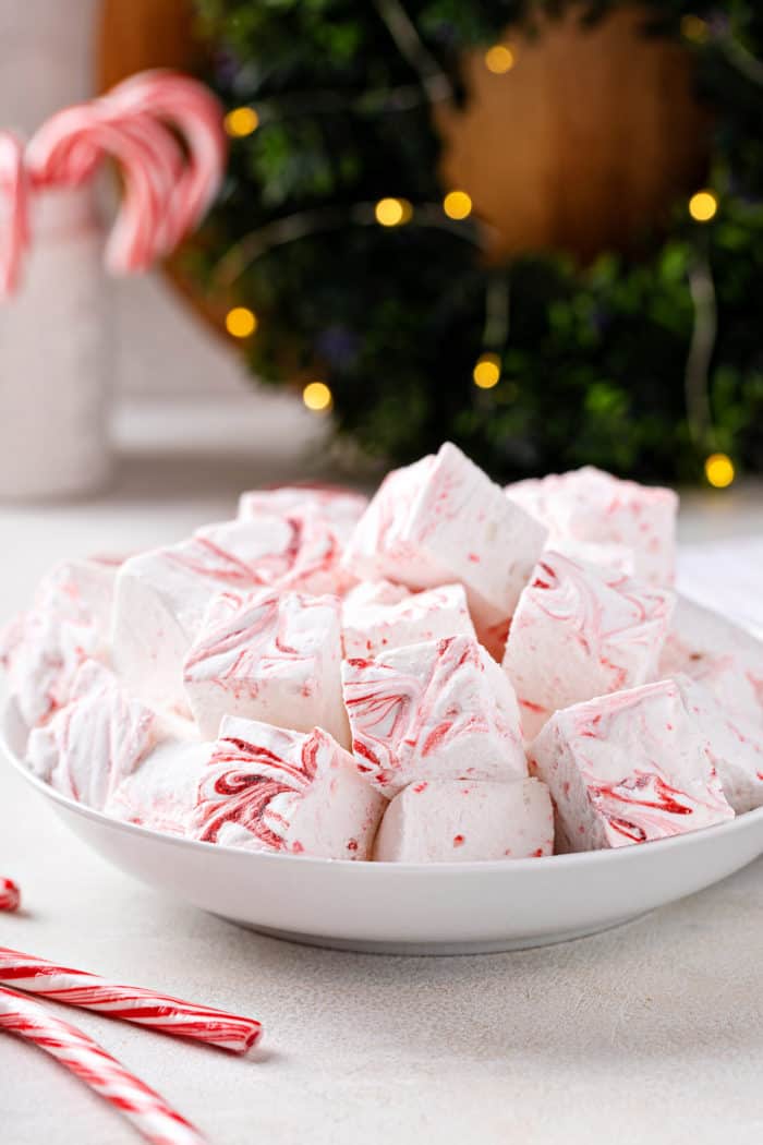 Homemade peppermint marshmallows piled into a white bowl.