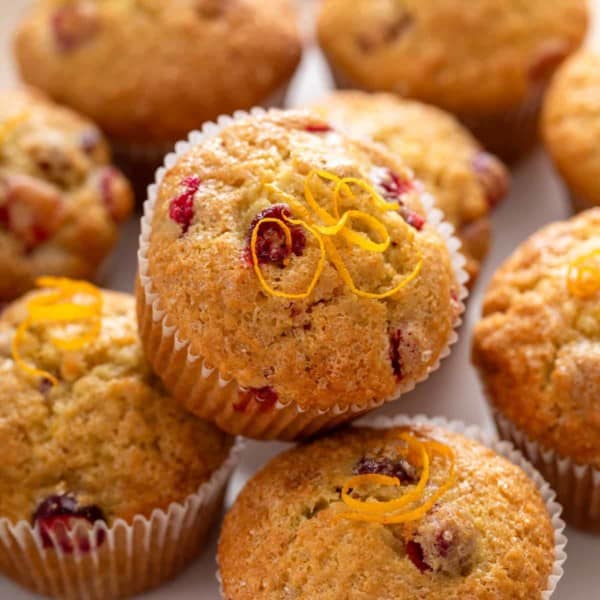 Close up of cranberry orange muffins on a platter.