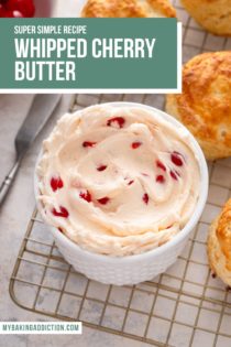 Close up of a bowl of whipped cherry butter on a wire rack next to biscuits. Text overlay includes recipe name.