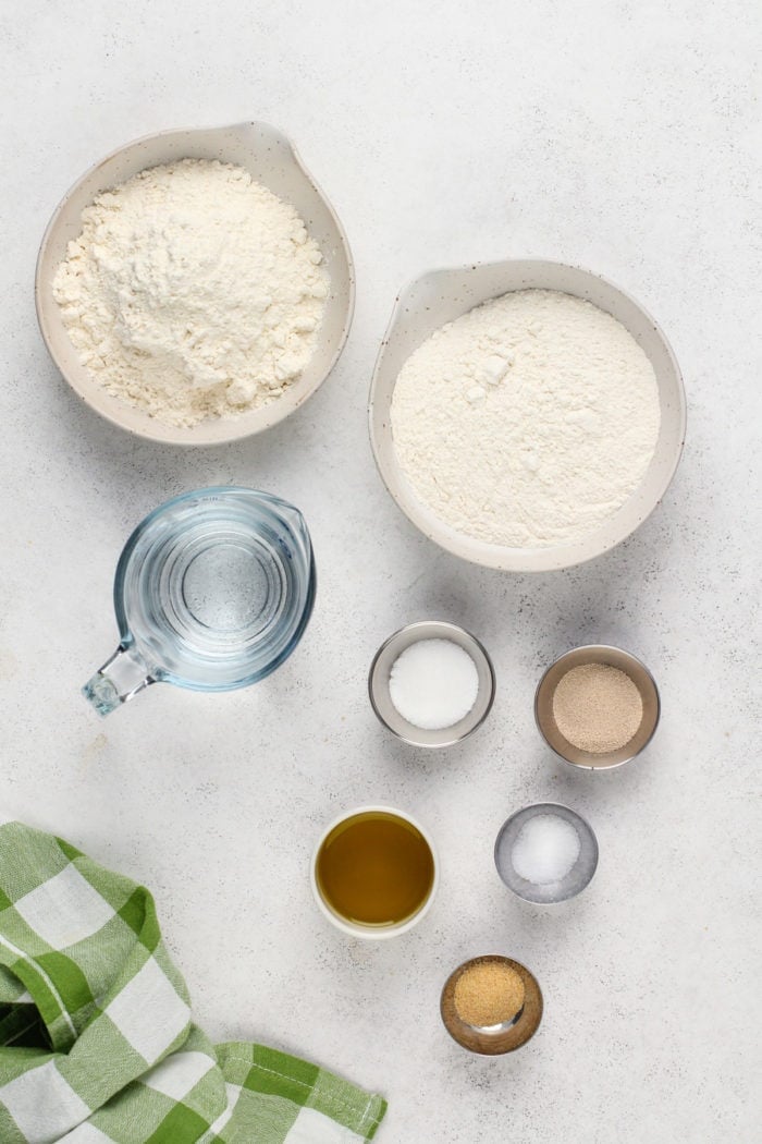 Ingredients for garlic knot dough arranged on a countertop.