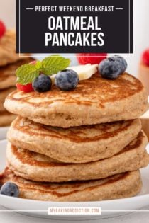 White plate with a stack of four oatmeal pancakes. A second stack of pancakes and container of syrup are in the background. Text overlay includes recipe name.
