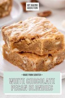 Two stacked white chocolate pecan blondies on a plate, with a bite taken from the corner of the top blondie. Text overlay includes recipe name.