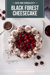 Overhead view of black forest cheesecake on a marble platter. Text overlay includes recipe name.