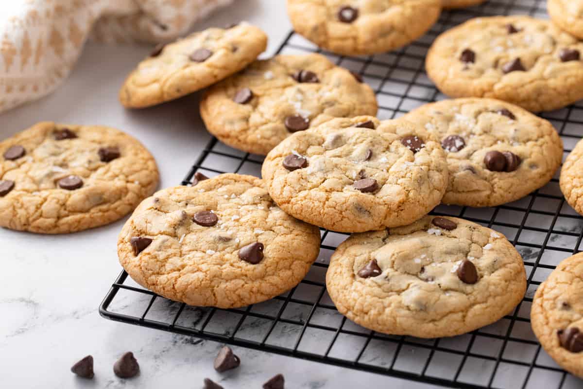 Grand floridian chocolate chip cookies arranged on a wire cooling rack.