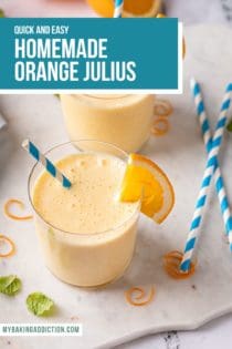 Two glasses of homemade orange julius on a countertop next to blue and white straws. Text overlay includes recipe name.