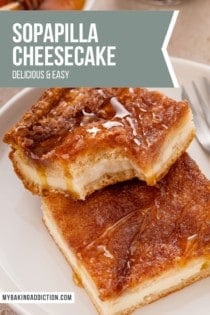 Two slices of sopapilla cheesecake on a white plate, with a bite taken from the corner from the top slice. Text overlay includes recipe name.