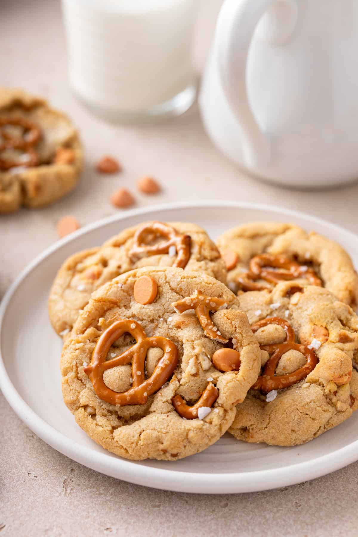 Salted caramel pretzel cookies on a white plate.