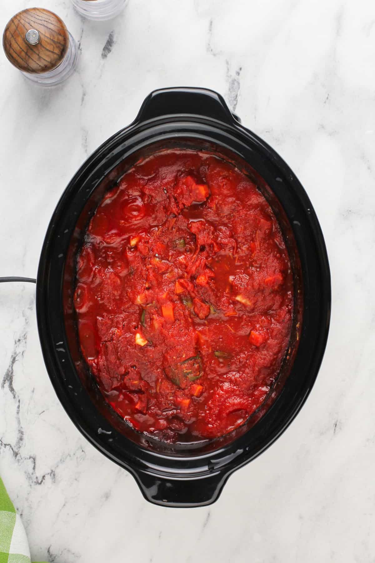 Cooked spaghetti sauce in a slow cooker, ready to be pureed.