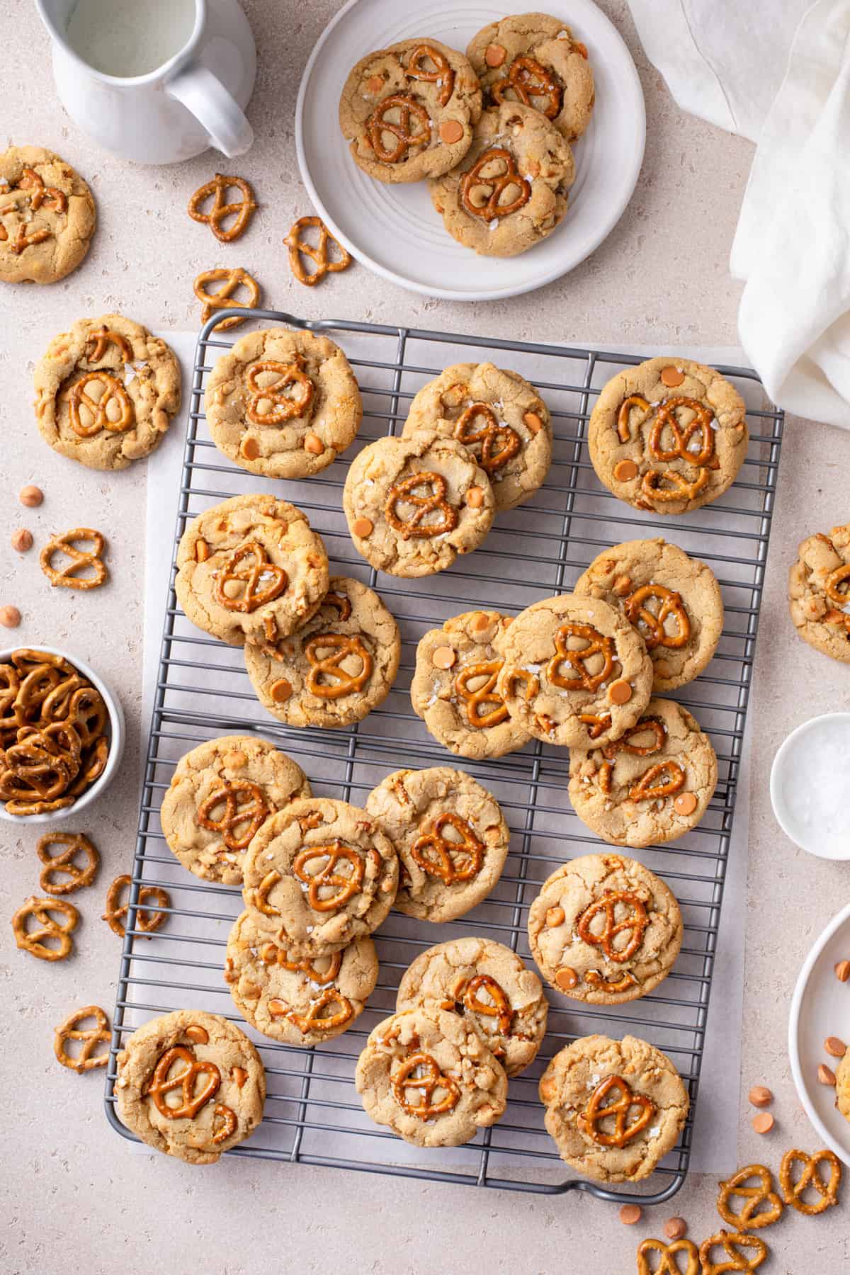 Overhead view of salted caramel pretzel cookies cooling on a wire rack.