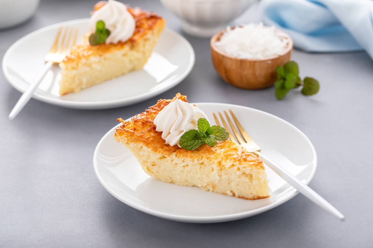 Slice of impossible coconut pie on a white plate.