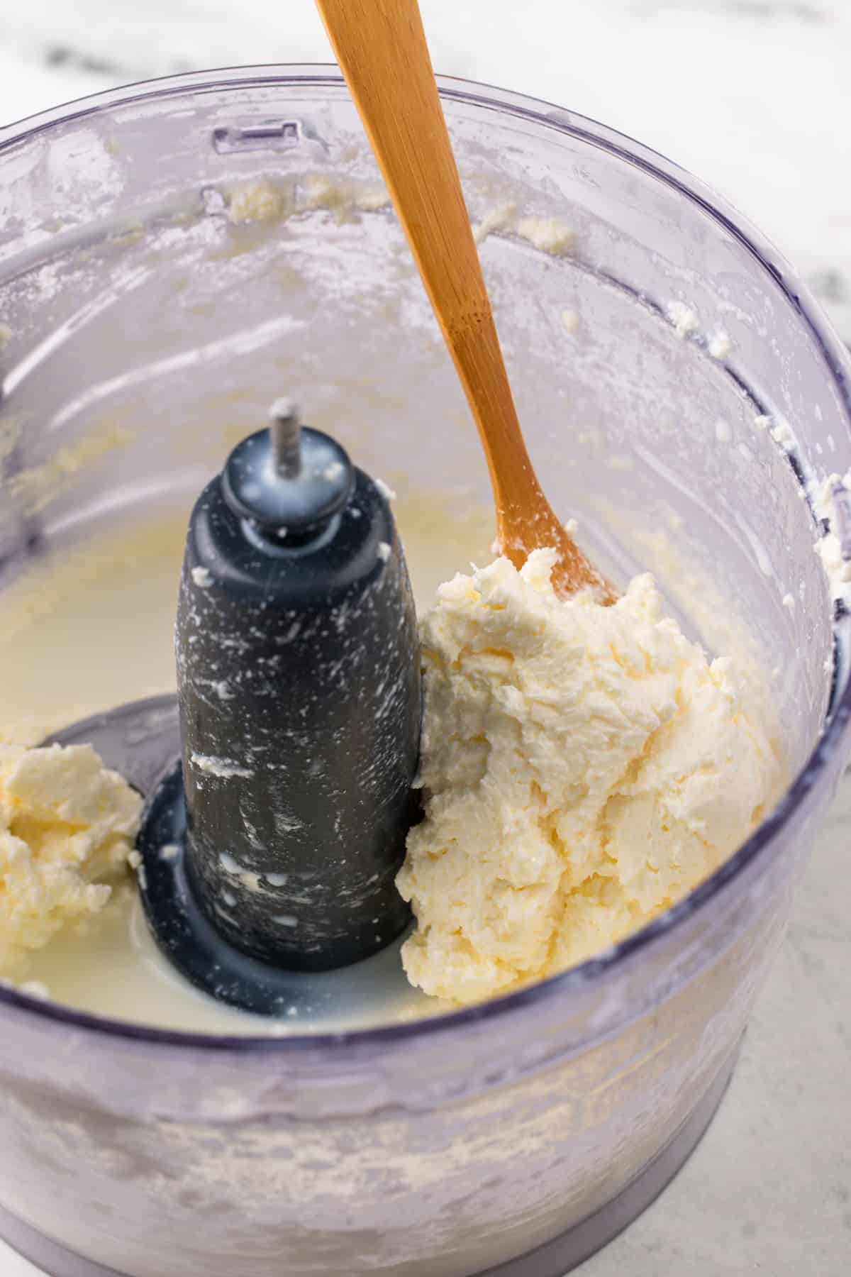 Separated butter and buttermilk in a food processor.