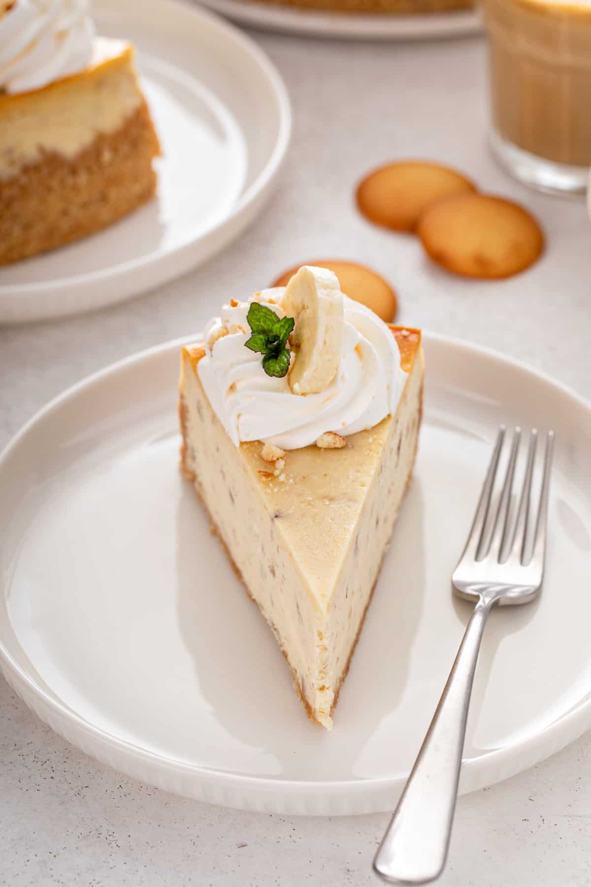 Front view of a plated slice of banana pudding cheesecake.