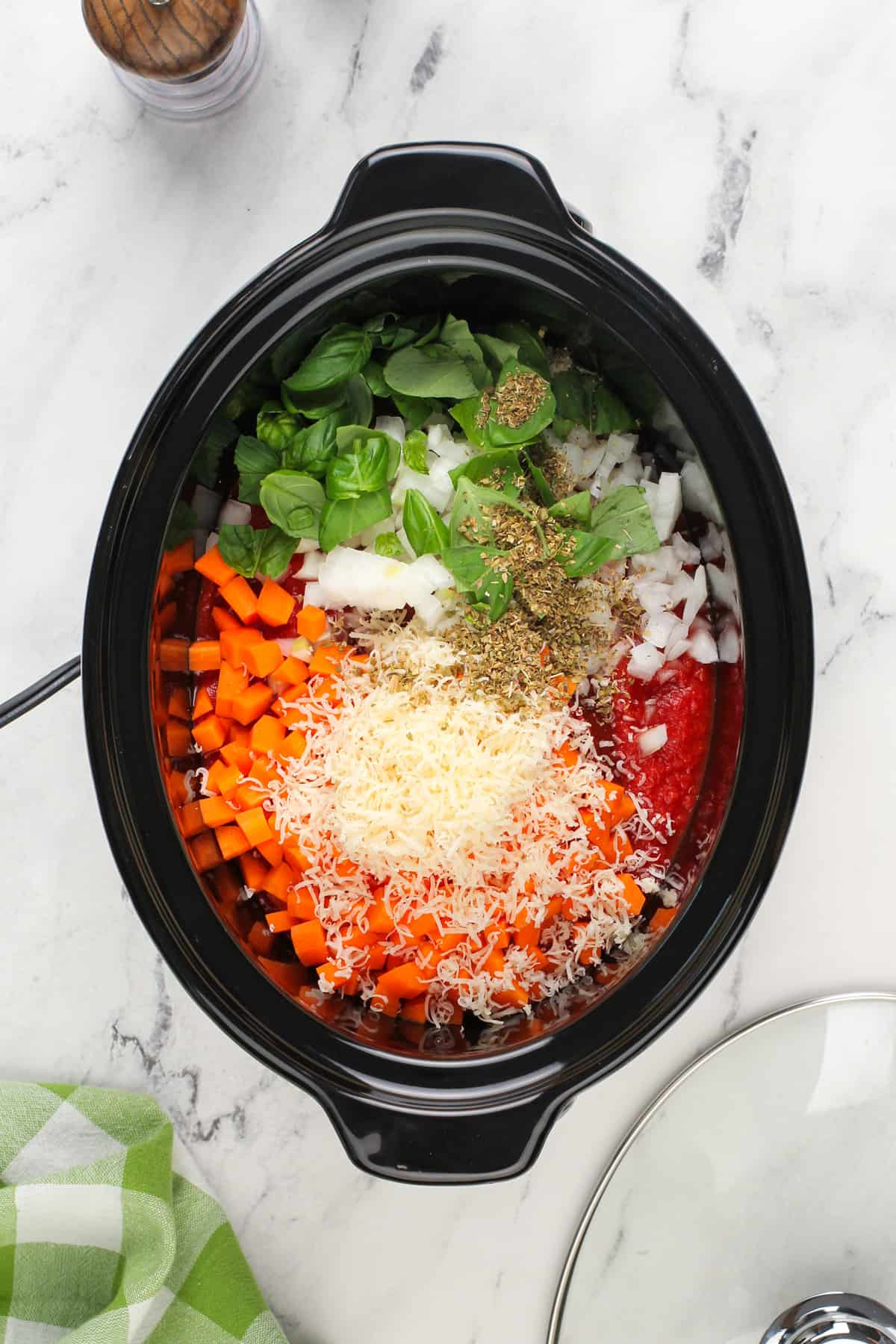 Spaghetti sauce ingredients in a slow cooker, ready to be cooked.