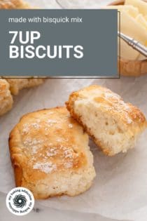 7up biscuits next to a bowl of butter on a piece of parchment paper. Text overlay includes recipe name.