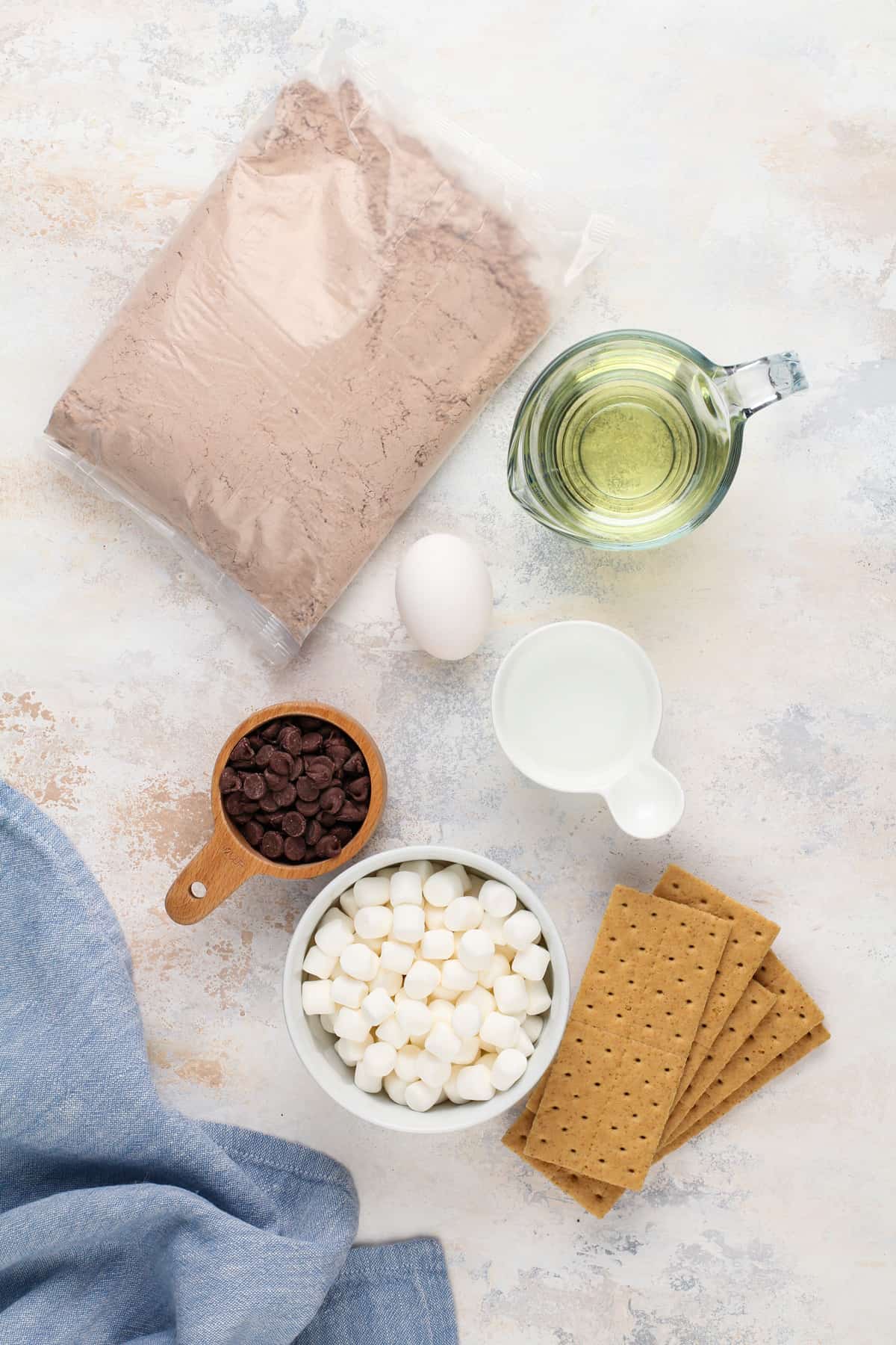 Ingredients for easy s'mores brownies arranged on a countertop.