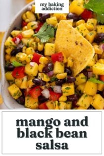 Bowl filled with mango and black bean salsa with a tortilla chip in it. Text overlay includes recipe name.