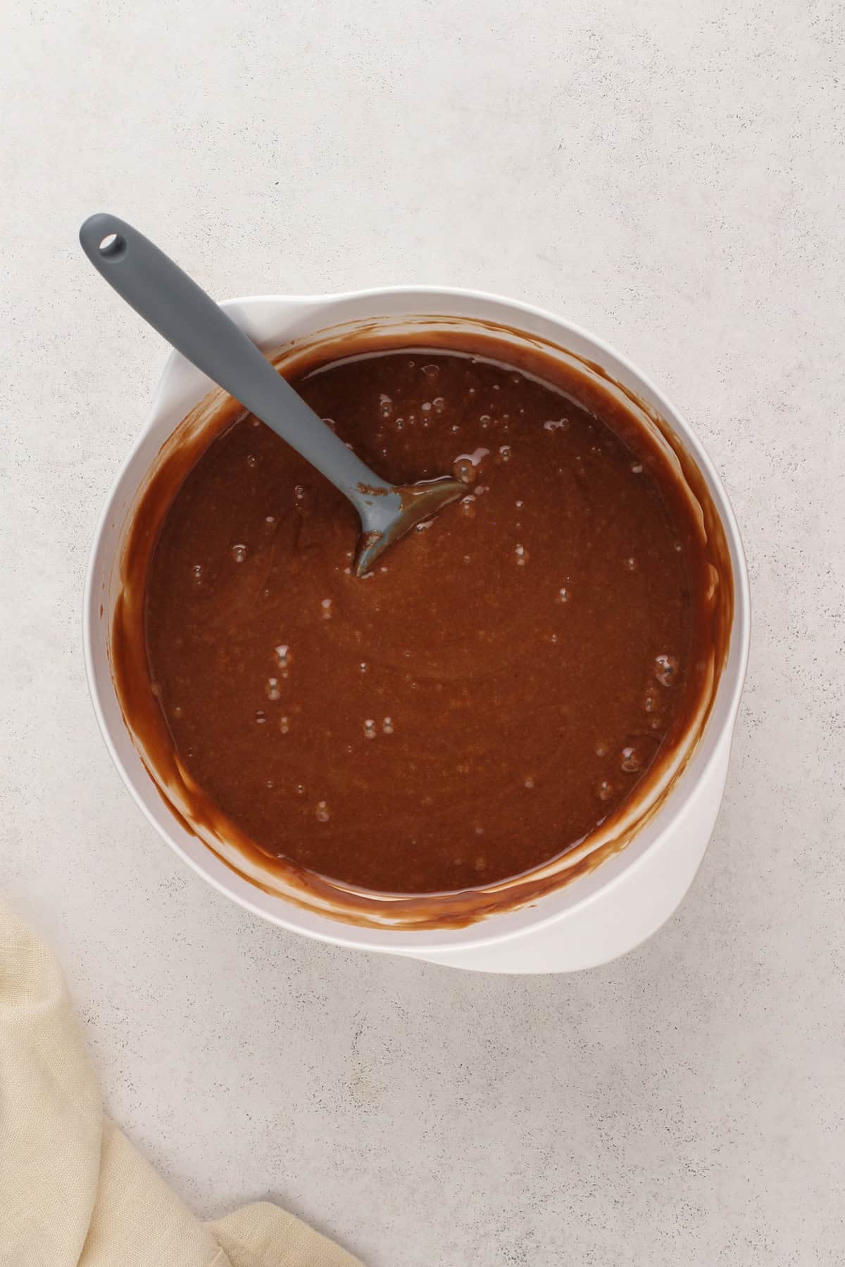 Texas sheet cake batter in a white bowl.