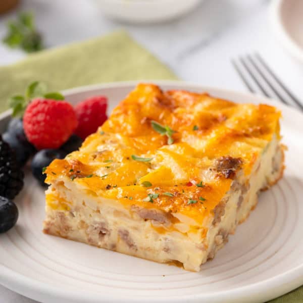 Slice of bisquick breakfast casserole on a white plate.