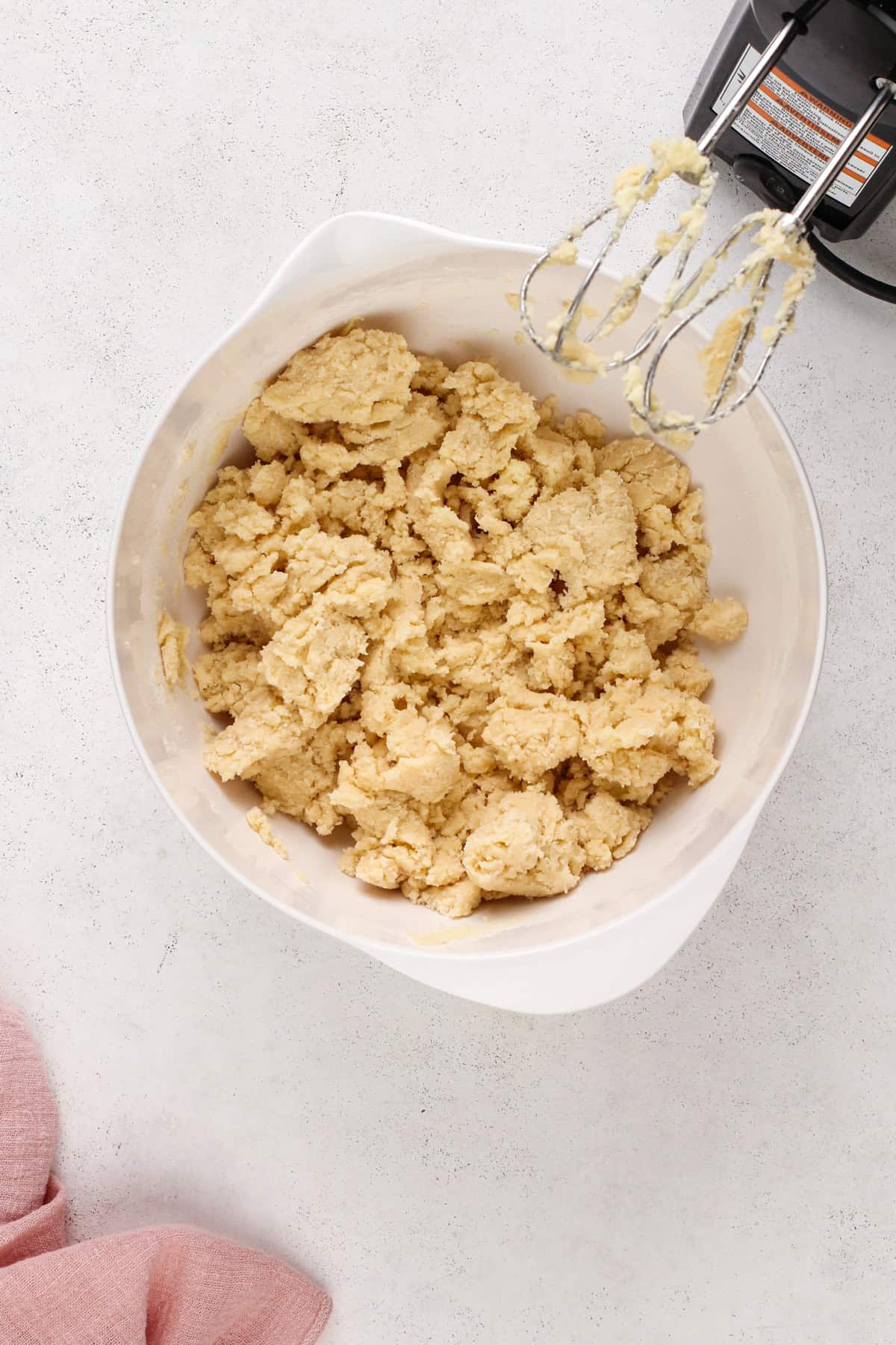 easy sugar cookie dough mixed in a white bowl.