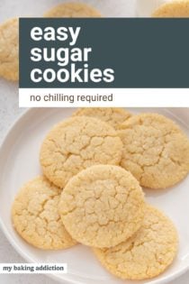 easy sugar cookies rolled in granulated sugar arranged on a white plate. Text overlay includes recipe name.